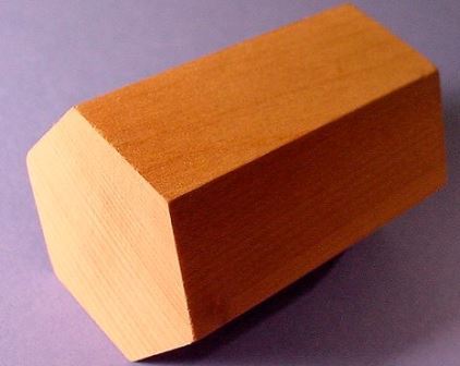 Image of a wooden hexagonal prism.