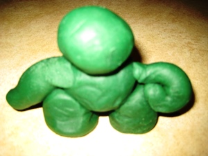This image shows a 3D shape person made with play dough.