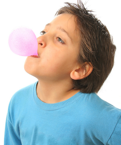 Decorative image of a child blowing a bubble with gum.
