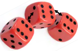 Three dice joint together. The faces with six dots are showing.