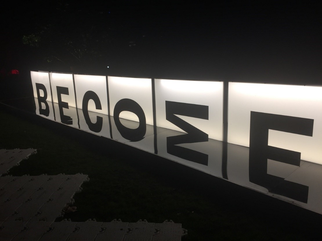 An image of a light installation created using symmetrical upper case letters.